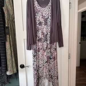 Never worn.     Beautiful dress with lightweight sweater